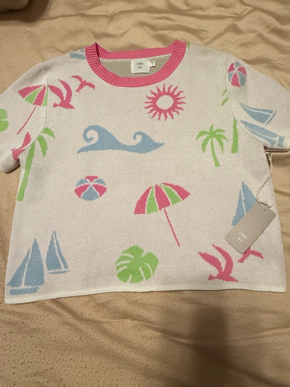 Luna Ivy woman’s size L beach themed crop sweater